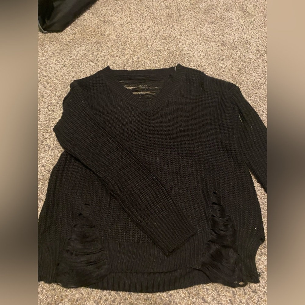 black sweater with distress patches